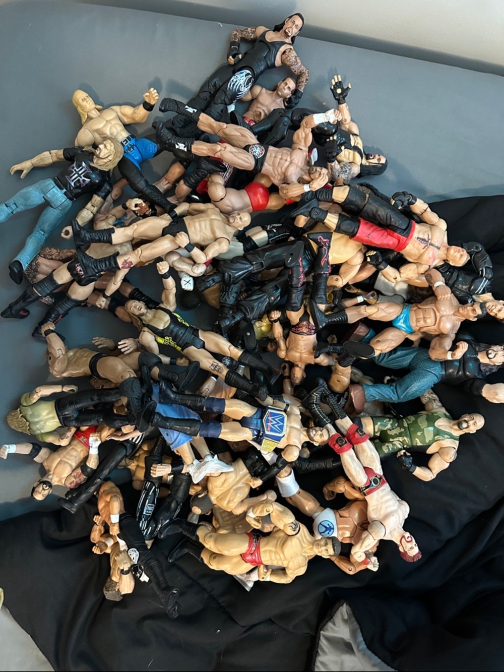 WWE Action Figure Pile - Black, Blue, Red, Tan Figures